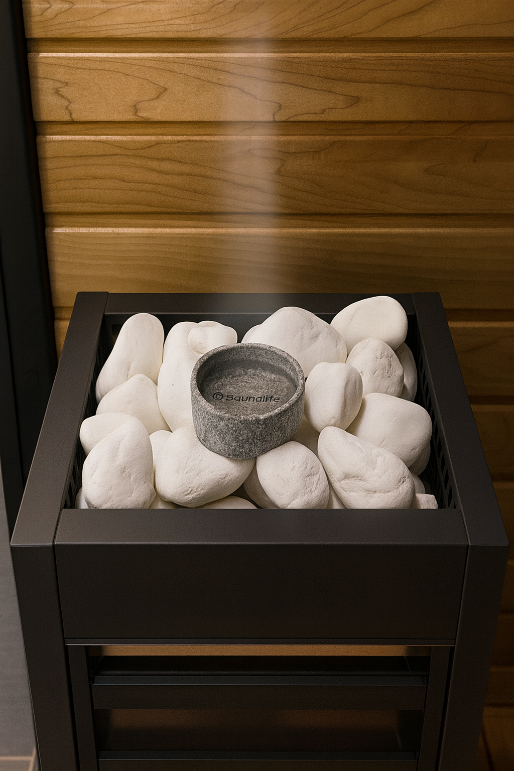 SaunaLife sauna aroma cup placed on white sauna stones inside black heater in wooden sauna room