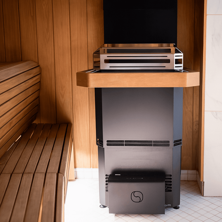 Saunum electric sauna heater with climate equalizer installed in a wooden sauna environment