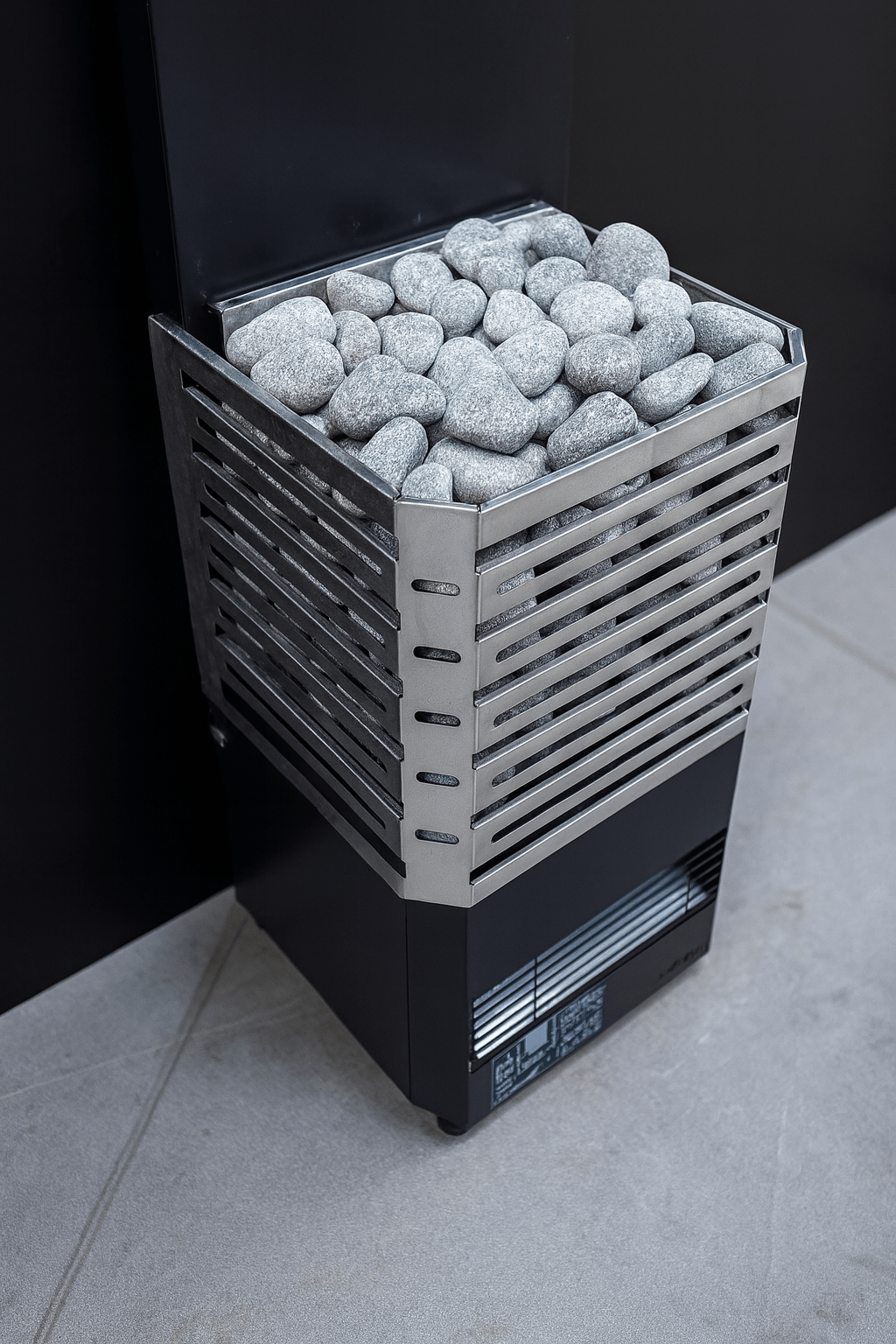 Saunum AIR L-13 electric sauna heater with decorative stones for an efficient sauna experience