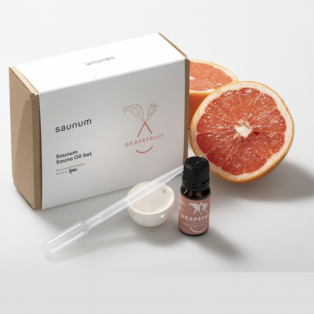 Saunum grapefruit sauna aroma oil set with essential oil bottle and grapefruit halves for a refreshing spa experience