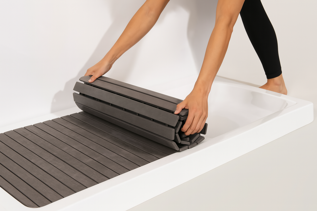 Sierra Spa luxury cold plunge basin accessory with person rolling a black cover over the basin