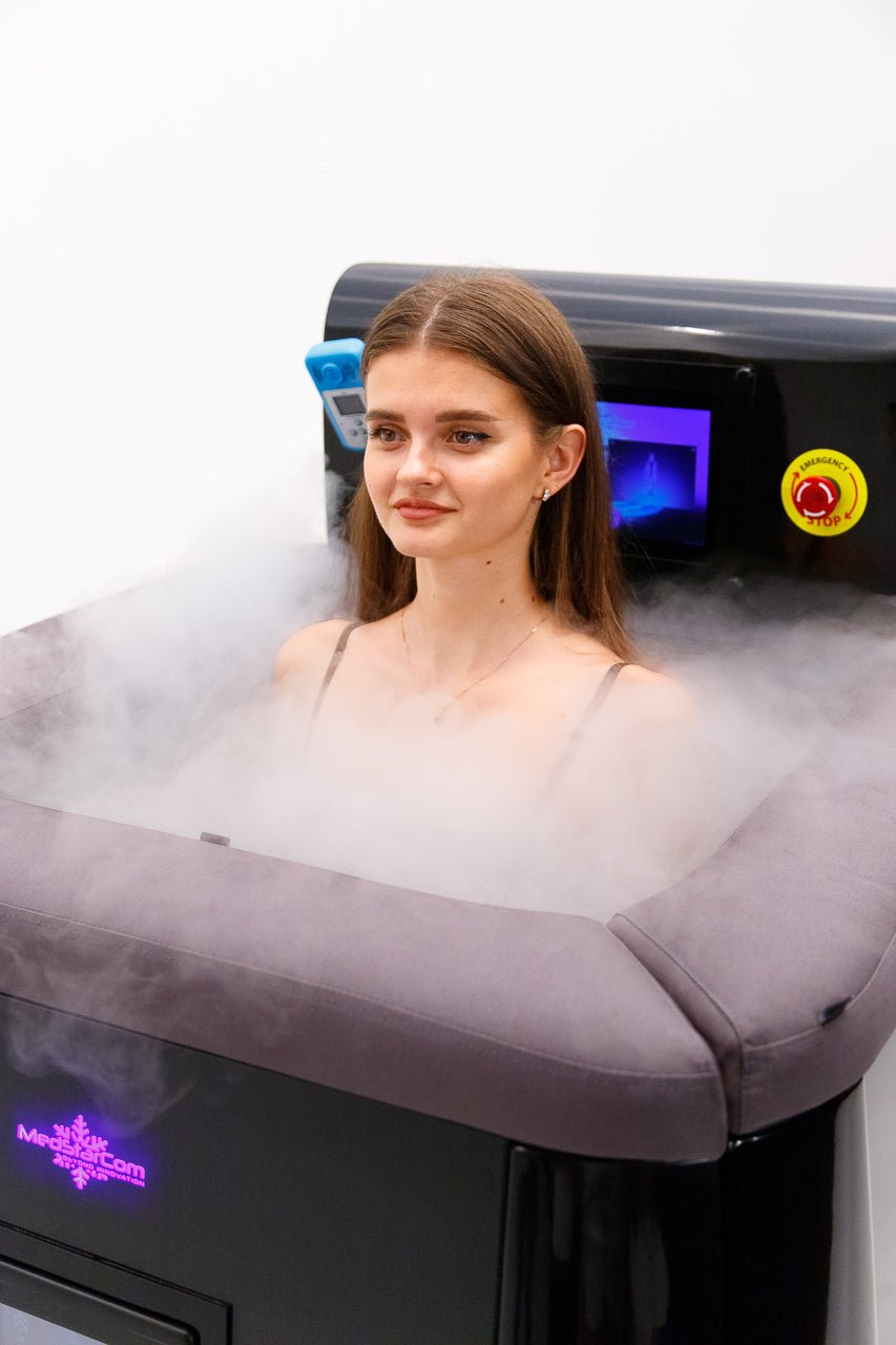 Vacuactivus cryotherapy chamber with a woman relaxing inside the mist for recovery and wellness benefits