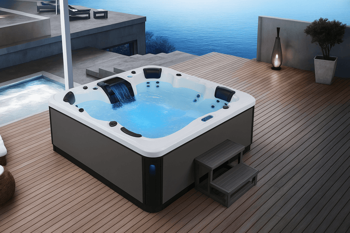 Victoria Elite Series spa with cascading waterfall and seating for relaxation on a modern deck