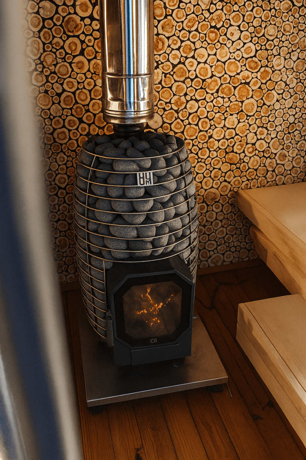HUUM wood burning sauna stove featuring a sleek design and stone cover for efficient heating