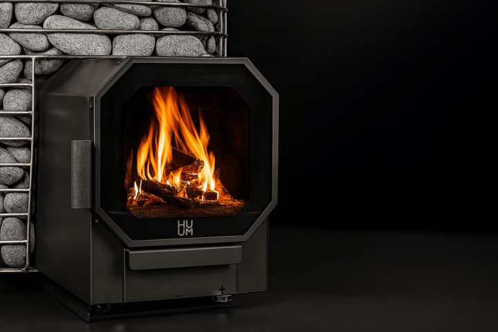 HUUM wood burning sauna stove with a modern design and visible flames for an authentic sauna experience